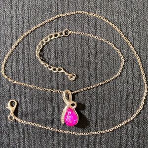 Necklace with purple crystal pendant